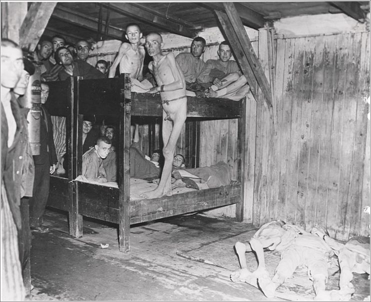 Mauthausen - battered & barely alive, prisoners come down from their beds after liberation